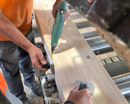 Knot Filler used to repair an edge in CLT timber production