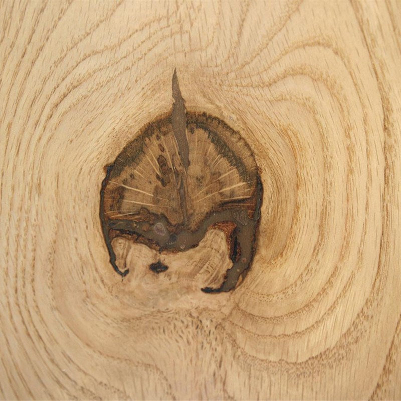 Walnut filler matched into a wood knot, sanded flush